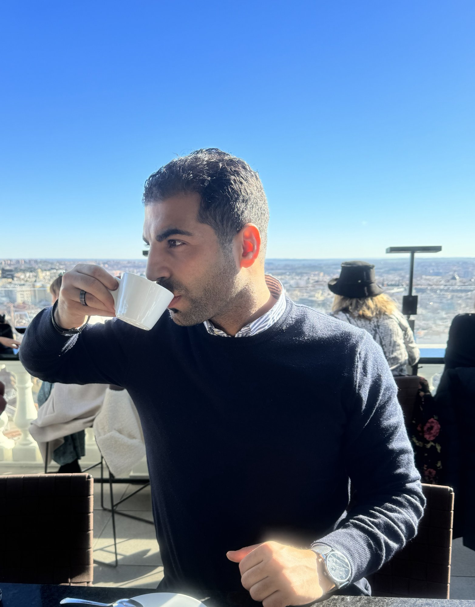 Siwar Ala — Founder of Epicafe, enjoying coffee with a panoramic view of Madrid